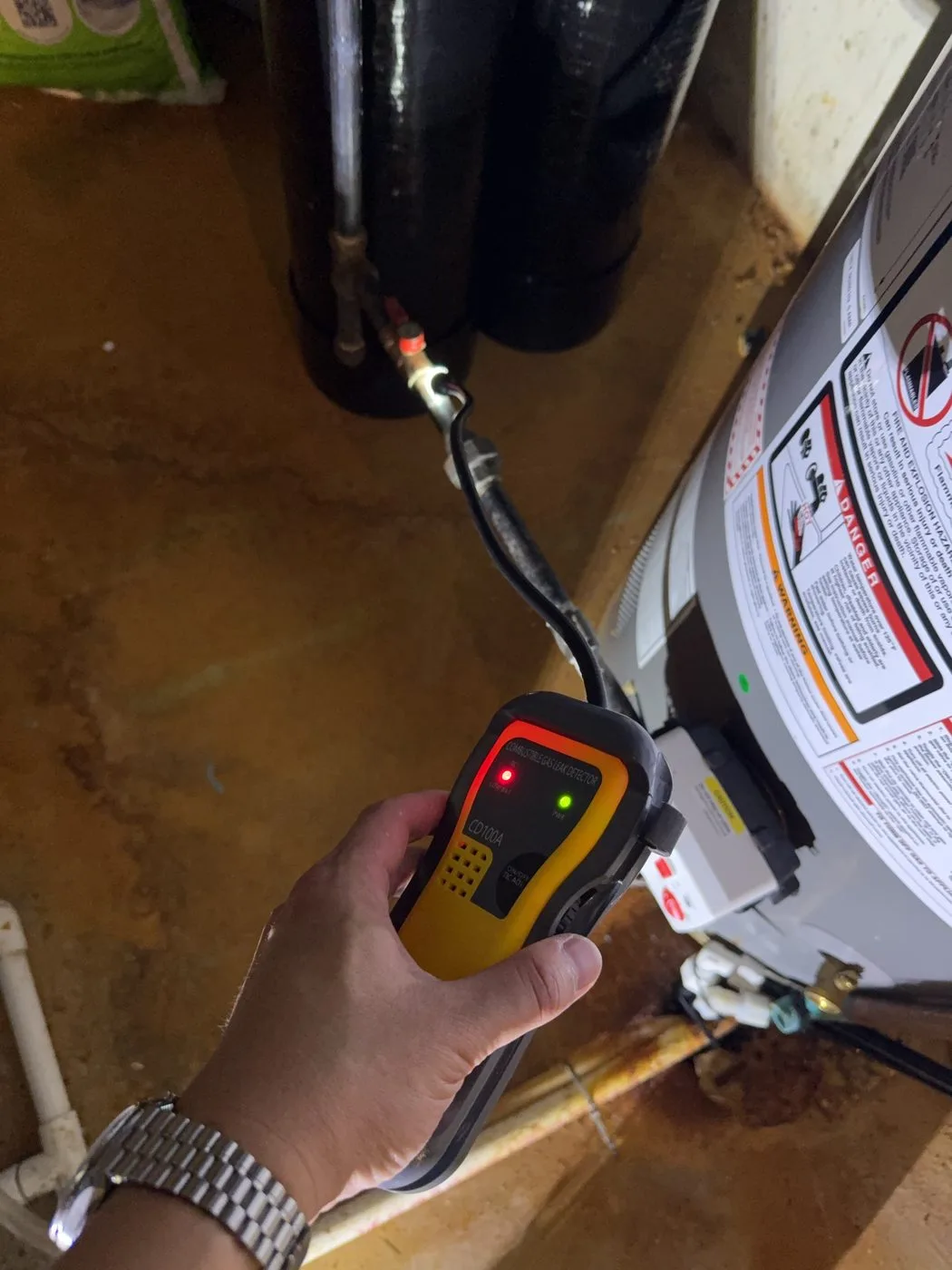 A combustible gas detector at a gas appliance connection during a Chicago inspection.