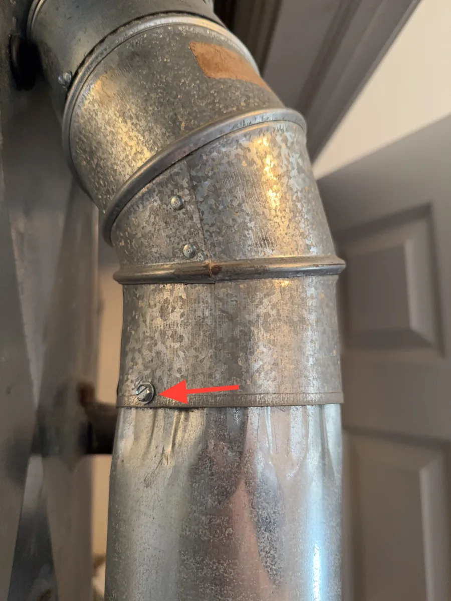 Furnace vent connector joint secured with a single screw